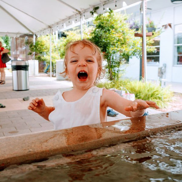 Child at baptismal pool